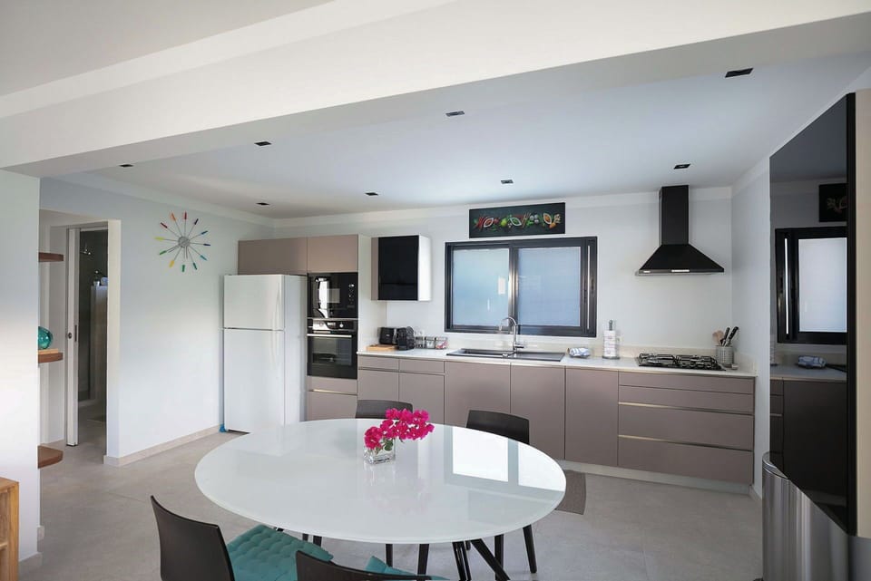 Fully equipped and air-conditioned kitchen, with electric oven, electrical stove, fridge and freezer, dish washer, microwave, toaster, electrical kettle, Nespresso and regular coffee machine, blender. Indoor table for 4 guests. Outdoor dining table. 