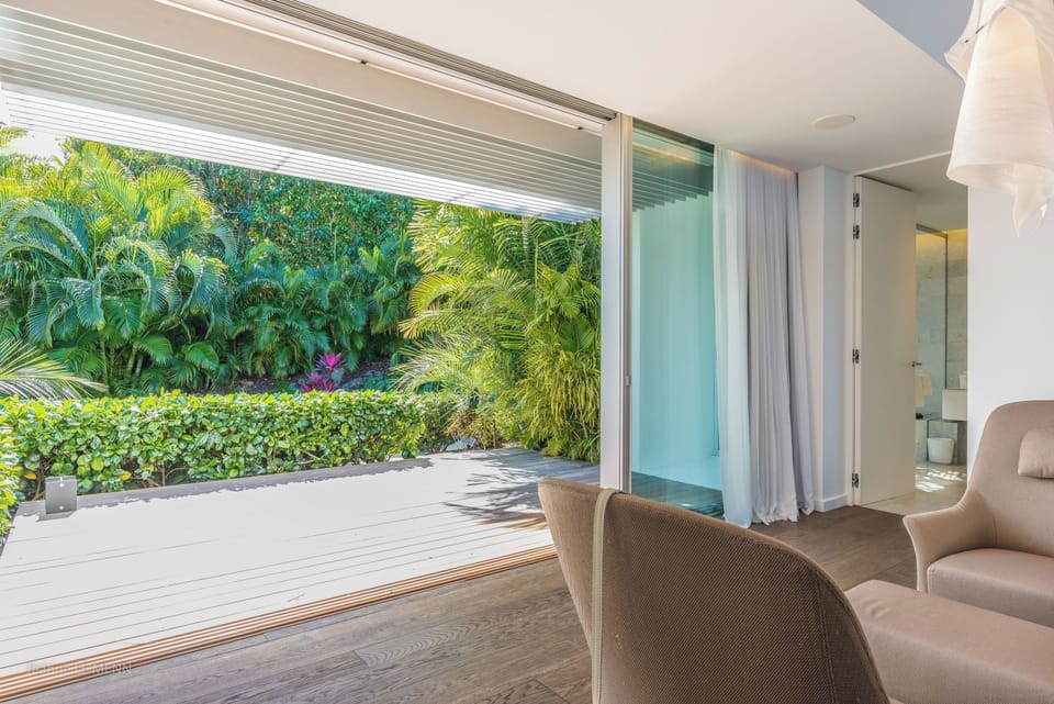 On an upper level. King size bed, air conditioning, ceiling fan, HD-TV, dish network, safe, dressing room. Ensuite bathroom with indoor Italian shower, bathtub, hair dryer, towels and beach towels. Private terrace. 