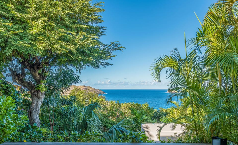 On an upper level. This room is accessed from the outside. King size bed, air conditioning, ceiling fan, HD-TV, dish network, safe, dressing room. Ensuite bathroom with indoor Italian shower, bathtub, hair dryer, towels and beach towels. Private small kid