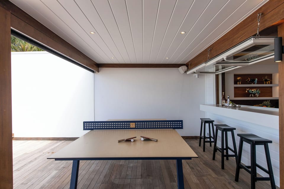 Fully equipped air-conditioned kitchen with electric oven, induction cooker, microwave, fridge and freezer, dishwasher, toaster, coffee maker, blender, electric kettle. Indoor dining table and outdoor table on the covered terrace. 