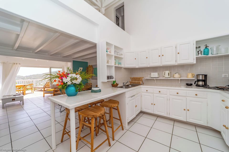 Fully equipped kitchen with breakfast bar for 4, electric oven, gas stove, microwave, dishwasher, regular coffee machine, fridge and freezer, toaster, electric kettle. Charcoal BBQ on the terrace. Indoor dining area, and dining table for 6 people on the c