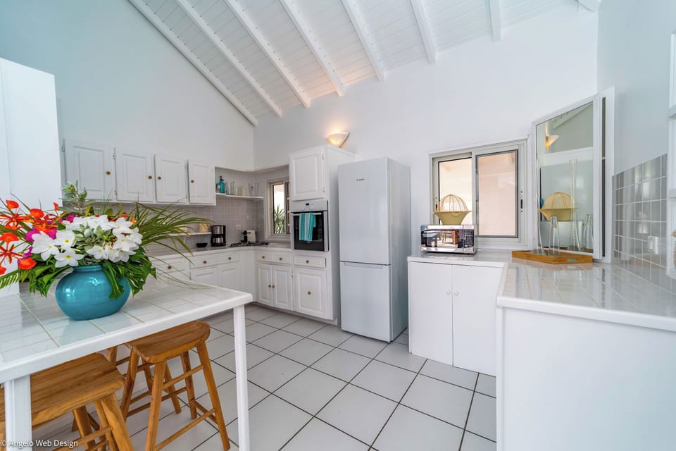 Fully equipped kitchen with breakfast bar for 4, electric oven, gas stove, microwave, dishwasher, regular coffee machine, fridge and freezer, toaster, electric kettle. Charcoal BBQ on the terrace. Indoor dining area, and dining table for 6 people on the c