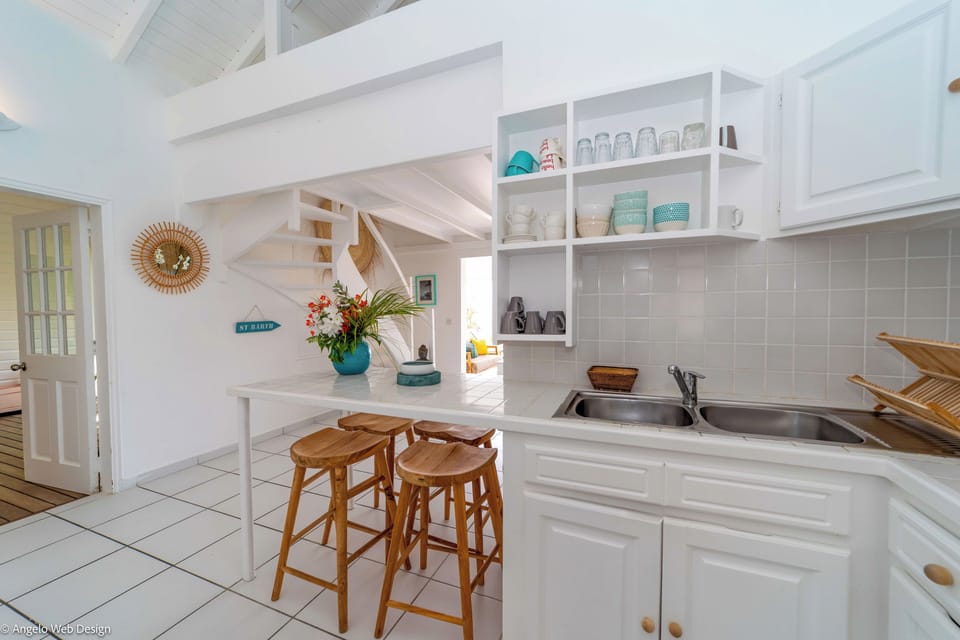 Fully equipped kitchen with breakfast bar for 4, electric oven, gas stove, microwave, dishwasher, regular coffee machine, fridge and freezer, toaster, electric kettle. Charcoal BBQ on the terrace. Indoor dining area, and dining table for 6 people on the c