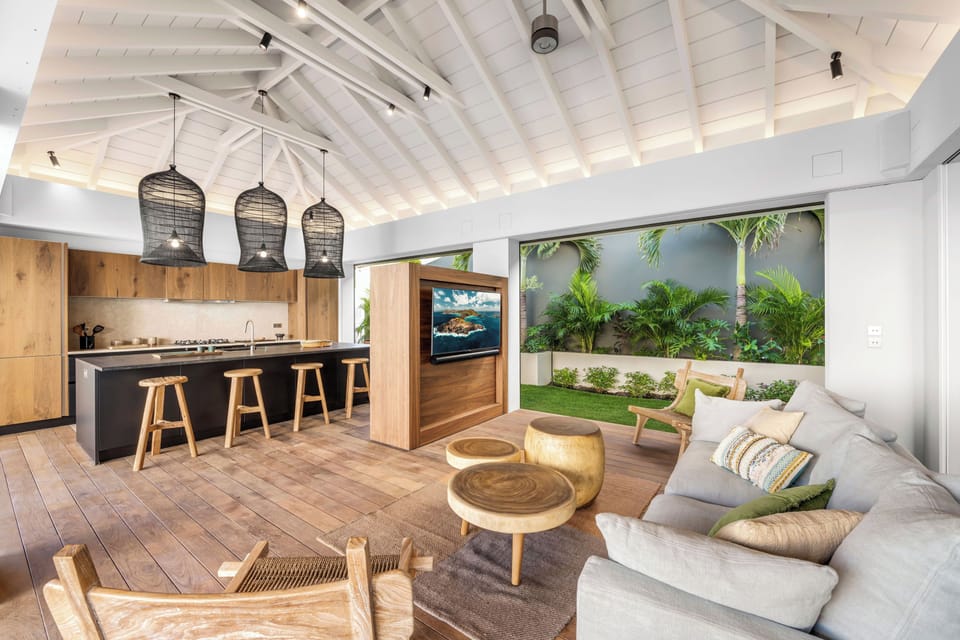 Great room, with open-air floor plan.  HD-TV, Apple TV. The living room opens onto the terrace and the views. 