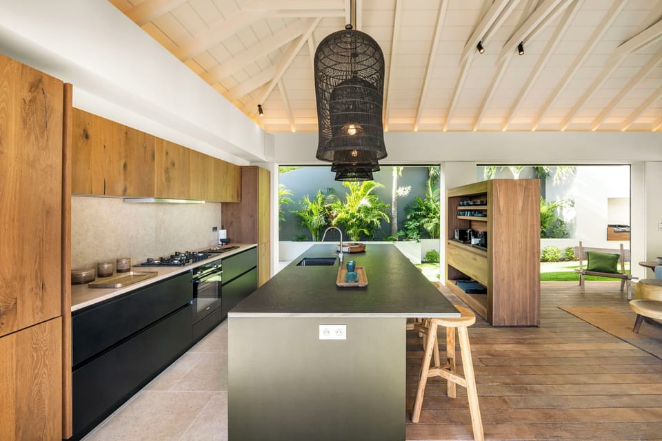 Fully equipped kitchen, central island unit, fridge and freezer with ice machine, cooking range with gas burners, hood, microwave, dishwasher, filter coffee maker and espresso coffee machine, wine cooler, toaster. Outdoor wooden dining table on the back o