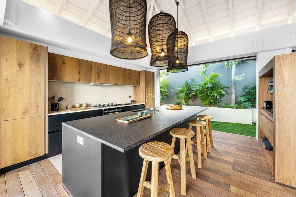 Fully equipped kitchen, central island unit, fridge and freezer with ice machine, cooking range with gas burners, hood, microwave, dishwasher, filter coffee maker and espresso coffee machine, wine cooler, toaster. Outdoor wooden dining table on the back o