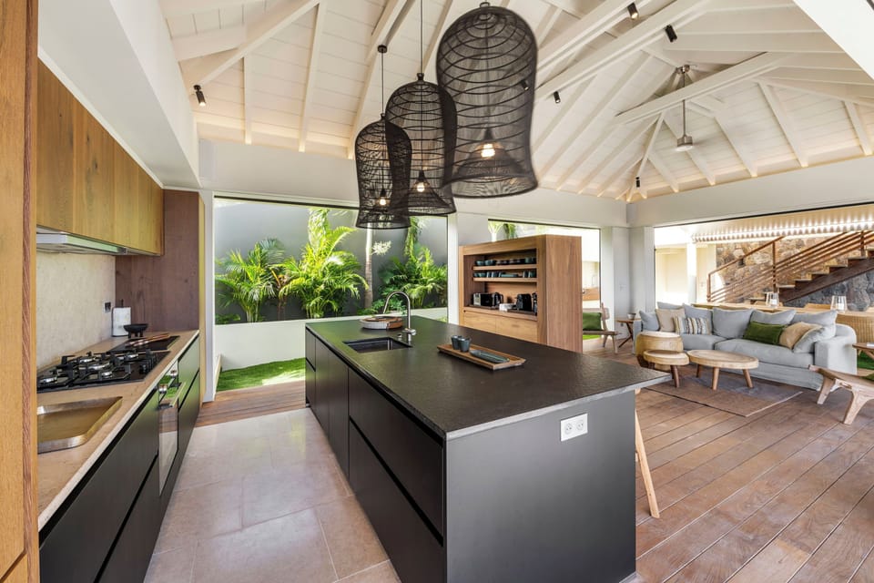 Fully equipped kitchen, central island unit, fridge and freezer with ice machine, cooking range with gas burners, hood, microwave, dishwasher, filter coffee maker and espresso coffee machine, wine cooler, toaster. Outdoor wooden dining table on the back o