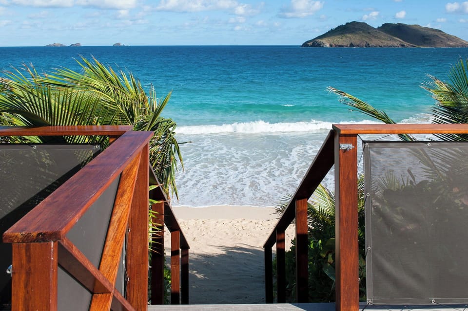 Direct access to the beach, deck chairs and loungers. Outdoor dining table on the gazebo. Gas barbecue. 