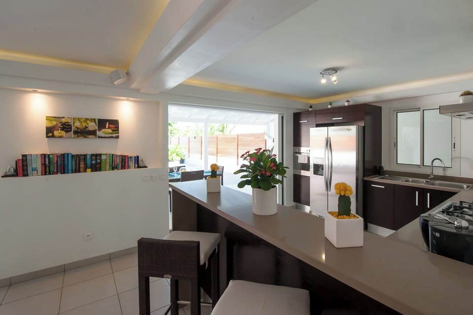 Fully equipped air-conditioned kitchen with electric oven, induction cooker, microwave, fridge and freezer, dishwasher, toaster, coffee maker, blender, electric kettle. Outdoor table on the covered terrace. 