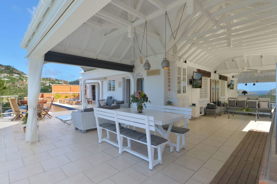 Fully equipped open-air, electric stove and oven, dishwasher, fridge and freezer, coffee and Nespresso machines, microwave, blender, kettle, fruit squeezer. Inside large white wooden table by the kitchen for up to 8 guests. Outside round teak table by the
