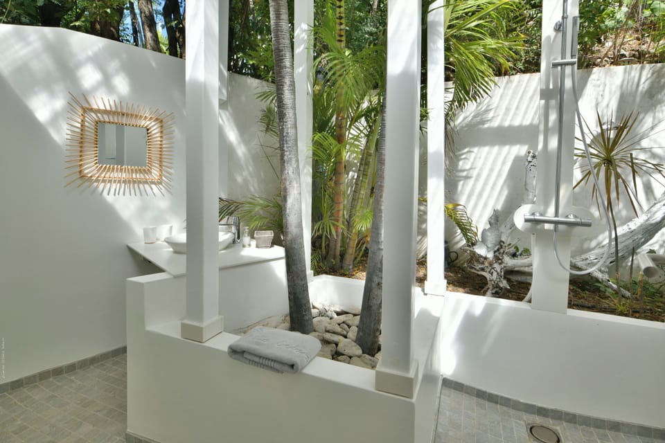 King size bed, air-conditioning, safe. Ensuite Bathroom, rain head shower, hair dryer. The bedroom opens onto a private terrace and the view. 