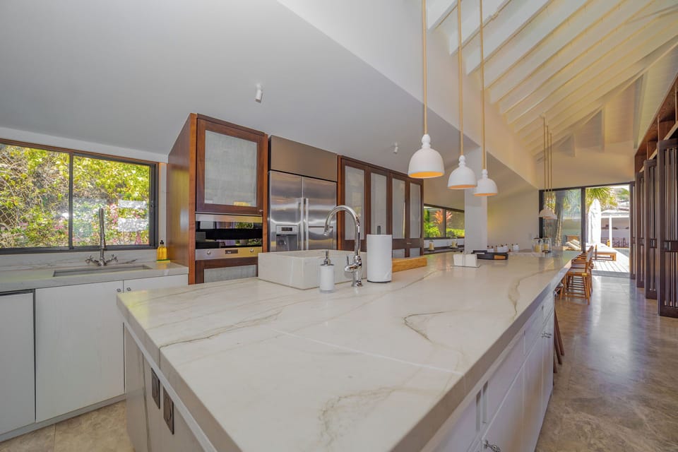 Fully equipped kitchen, electric oven, gas stove, microwave, fridge and freezer with ice maker, dishwasher, toaster, filter coffee maker and Nespresso machine, mixer, kettle, citrus press, fryer, hood. Large indoor dining table for 8 guests, and another o