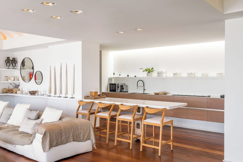 Modern and fully equipped kitchen. Coffee machine, dishwasher, espresso machine, gas cooker, microwave oven, oven, wine cellar. Dining area in the great room with a large rectangular wood table for 8-10 guests. A second dining table is available by the ba