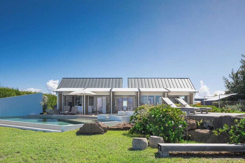 Beautiful lush garden surrounding the property. Private parking at the entrance of the villa. 