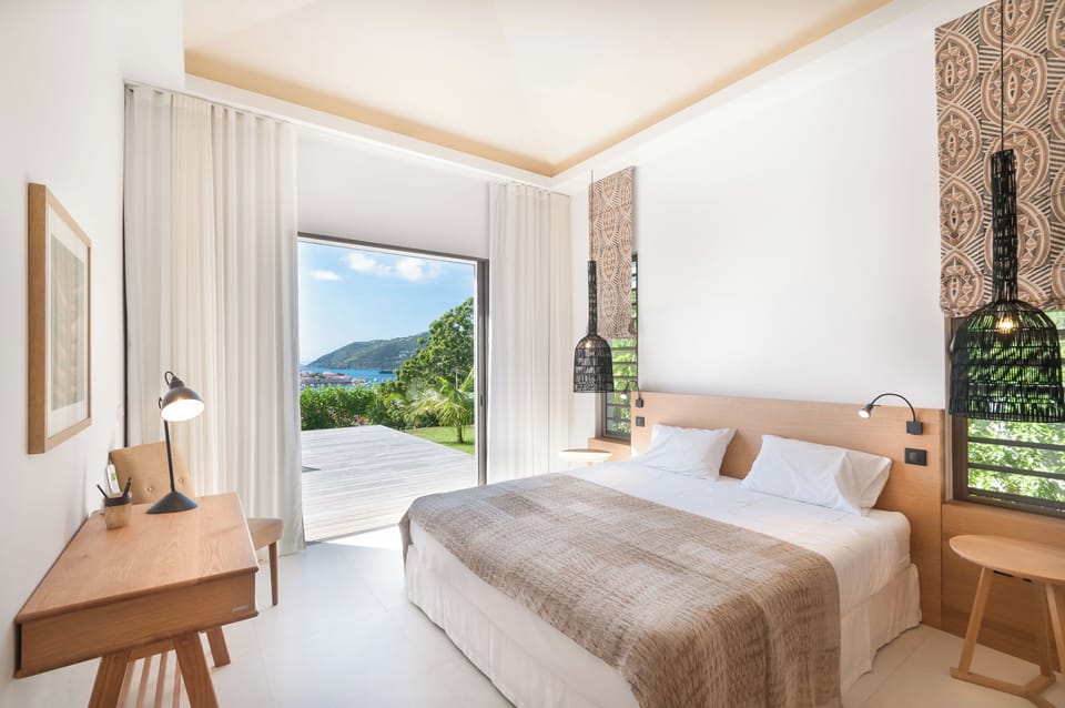 King size bed, air conditioning. Adjoining bathroom with shower, sink, hair dryer, towels and beach towels. 