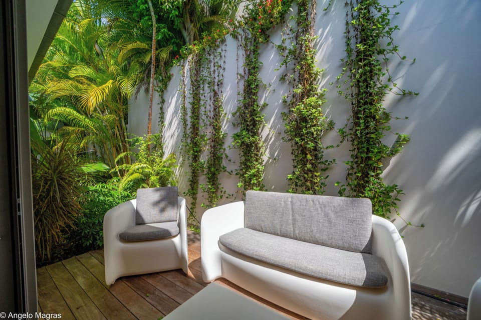 A queen size bed, air conditioning, ceiling fan, HD-TV, dish network, safe, dressing room, ensuite bathroom with indoor Italian shower, sink, hair dryer, towels and beach towels.