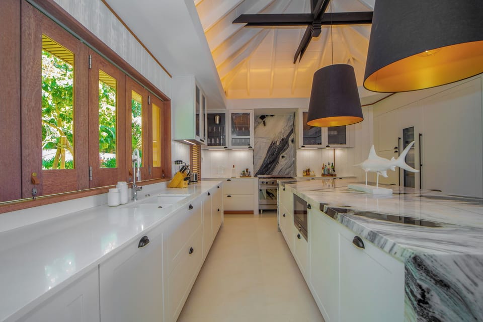Air-conditioned. Spacious gourmet kitchen, gas oven and stove, microwave, fridge/freezer with ice machine, dishwasher, wine cellar, juicer, coffee & Nespresso machines, toaster, mixer. Large wooden table located on the covered terrace.
