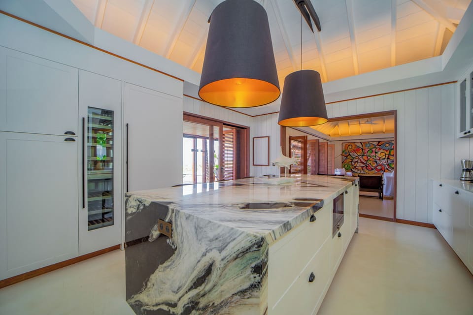 Air-conditioned. Spacious gourmet kitchen, gas oven and stove, microwave, fridge/freezer with ice machine, dishwasher, wine cellar, juicer, coffee & Nespresso machines, toaster, mixer. Large wooden table located on the covered terrace.