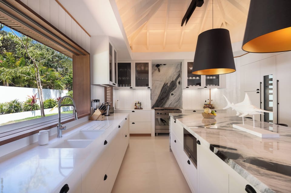 Air-conditioned. Spacious gourmet kitchen, gas oven and stove, microwave, fridge/freezer with ice machine, dishwasher, wine cellar, juicer, coffee & Nespresso machines, toaster, mixer. Large wooden table located on the covered terrace.