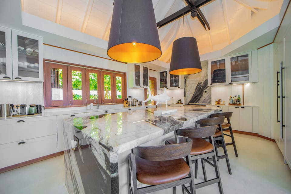 Air-conditioned. Spacious gourmet kitchen, gas oven and stove, microwave, fridge/freezer with ice machine, dishwasher, wine cellar, juicer, coffee & Nespresso machines, toaster, mixer. Large wooden table located on the covered terrace.
