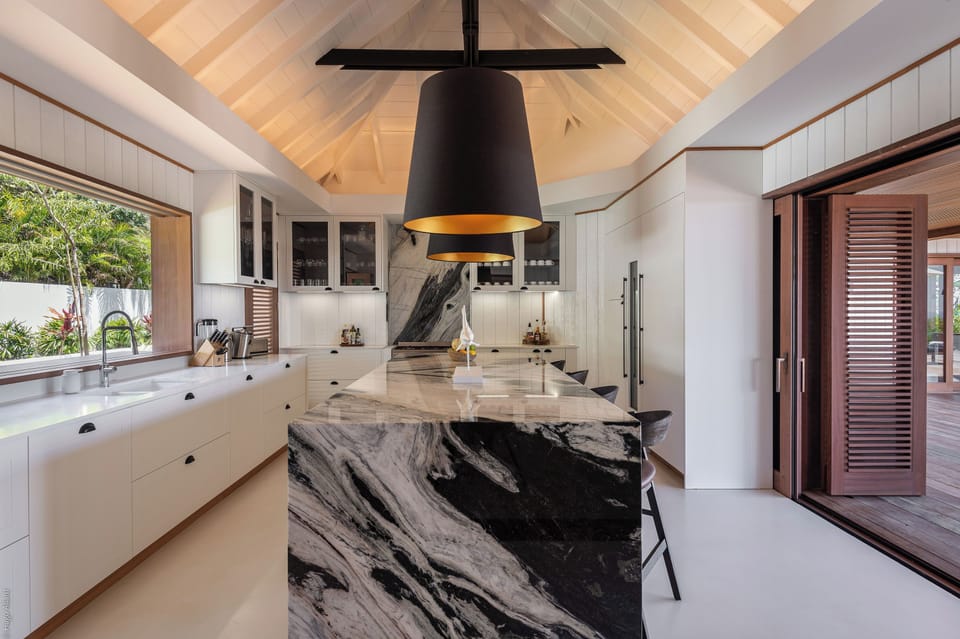 Air-conditioned. Spacious gourmet kitchen, gas oven and stove, microwave, fridge/freezer with ice machine, dishwasher, wine cellar, juicer, coffee & Nespresso machines, toaster, mixer. Large wooden table located on the covered terrace.