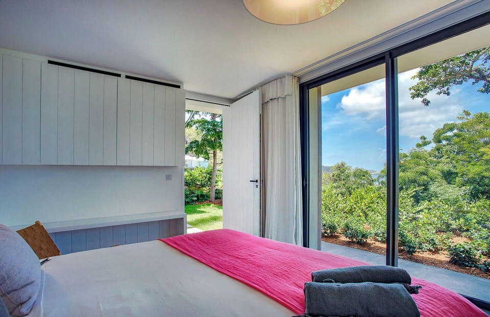 On the lowest level. King size bed, air conditioning, HD-TV, Apple TV, Dish Network, dressing room, programmable safe. Adjoining bathroom with shower, hair dryer, towels and beach towels. 
