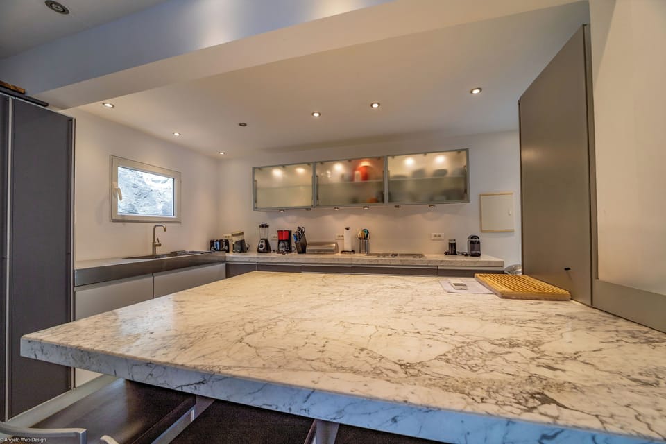 Fully equipped with bar, electric oven, gas stove, dishwasher, fridge and freezer, ice machine, microwave, toaster, filter coffee maker, and espresso coffee machine, blender, electric fruit press. Inside dining table in the great room. Outside dining tabl