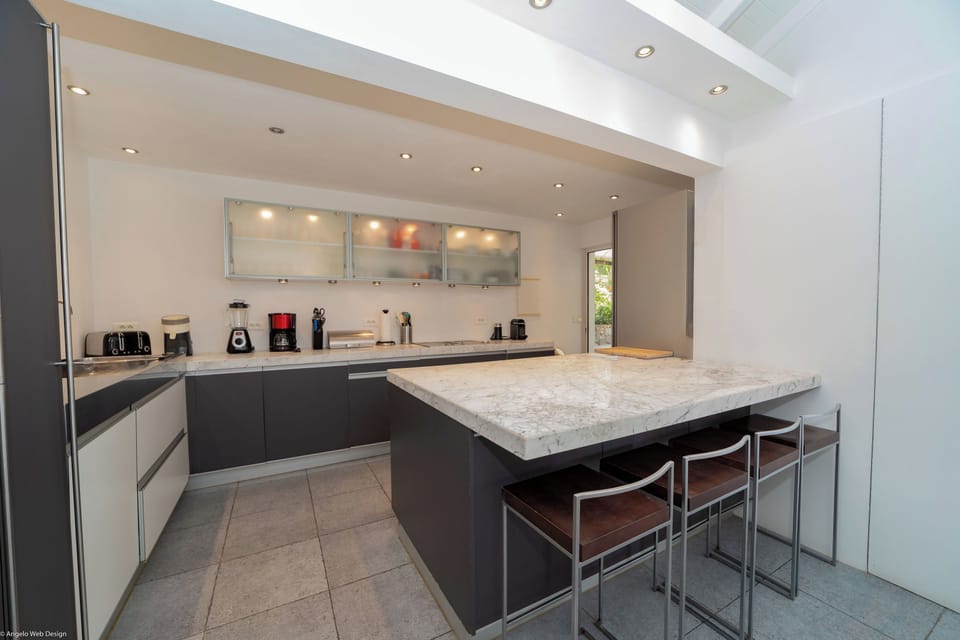 Fully equipped with bar, electric oven, gas stove, dishwasher, fridge and freezer, ice machine, microwave, toaster, filter coffee maker, and espresso coffee machine, blender, electric fruit press. Inside dining table in the great room. Outside dining tabl