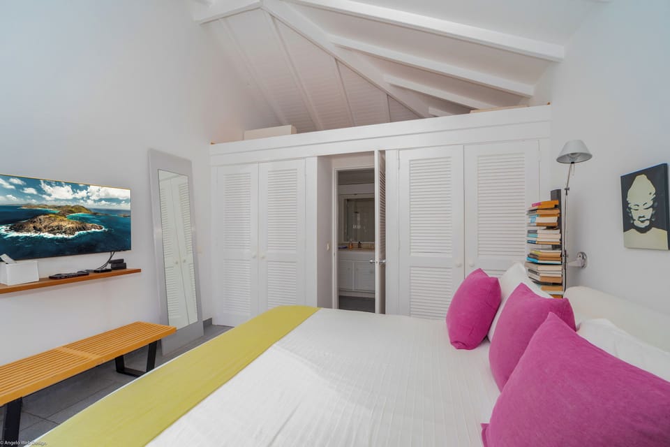 On the main level. Euro-King size bed, air conditioning, HD-TV, Apple TV, Dish Network, programmable safe. Adjoining bathroom with shower, hair dryer, towels and beach towels. 