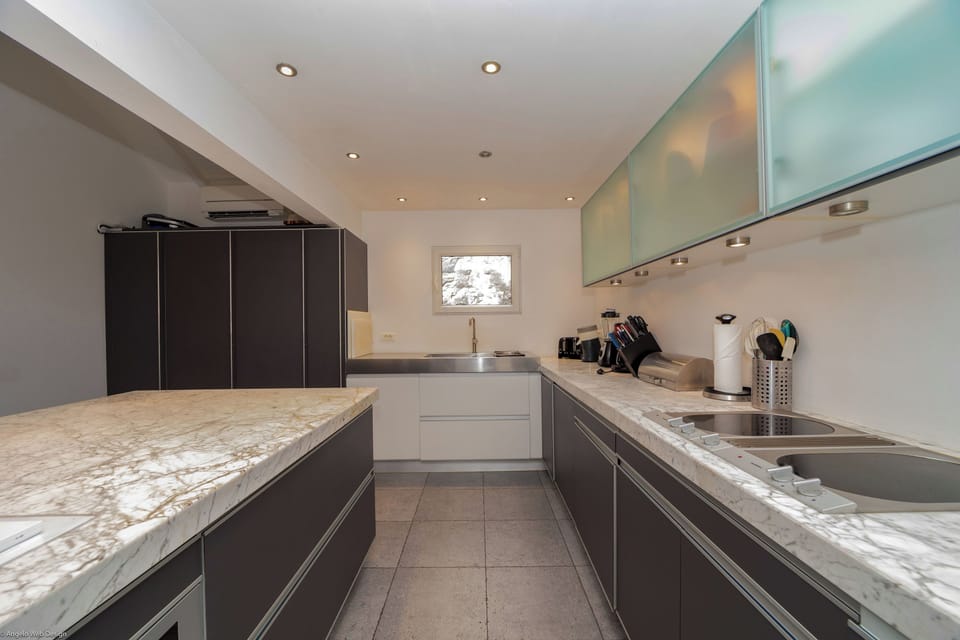 Fully equipped with bar, electric oven, gas stove, dishwasher, fridge and freezer, ice machine, microwave, toaster, filter coffee maker, and espresso coffee machine, blender, electric fruit press. Inside dining table in the great room. Outside dining tabl
