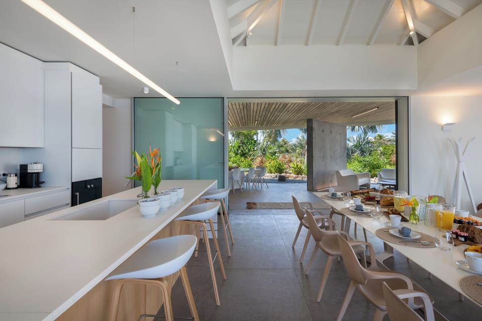 State of the art kitchen. Refrigerator, freezer, ice machine, dishwasher, oven, microwave, Nespresso machine, toaster, mixer, wine cellar.Back kitchen for private chef. Bar with stools. Professional Pizza oven. Indoor and outdoor dining areas for 10 guest