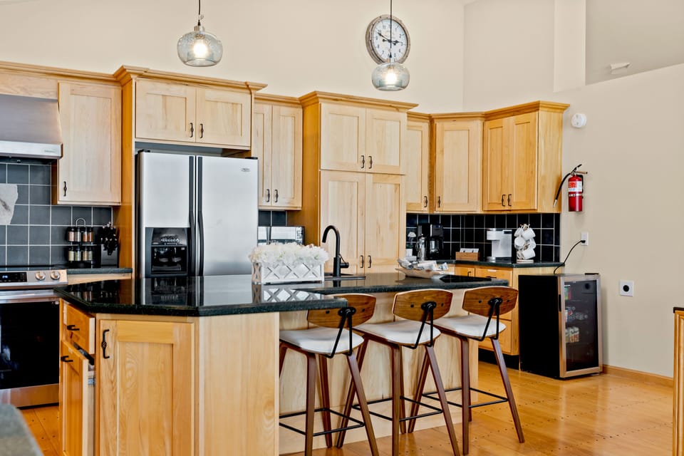 This kitchen has a coffee/tea bar and a beverage cooler. 