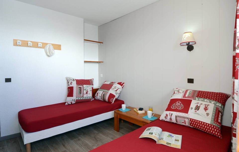 There's a bedroom with 2 Single beds and a mezzanine with Bunks.