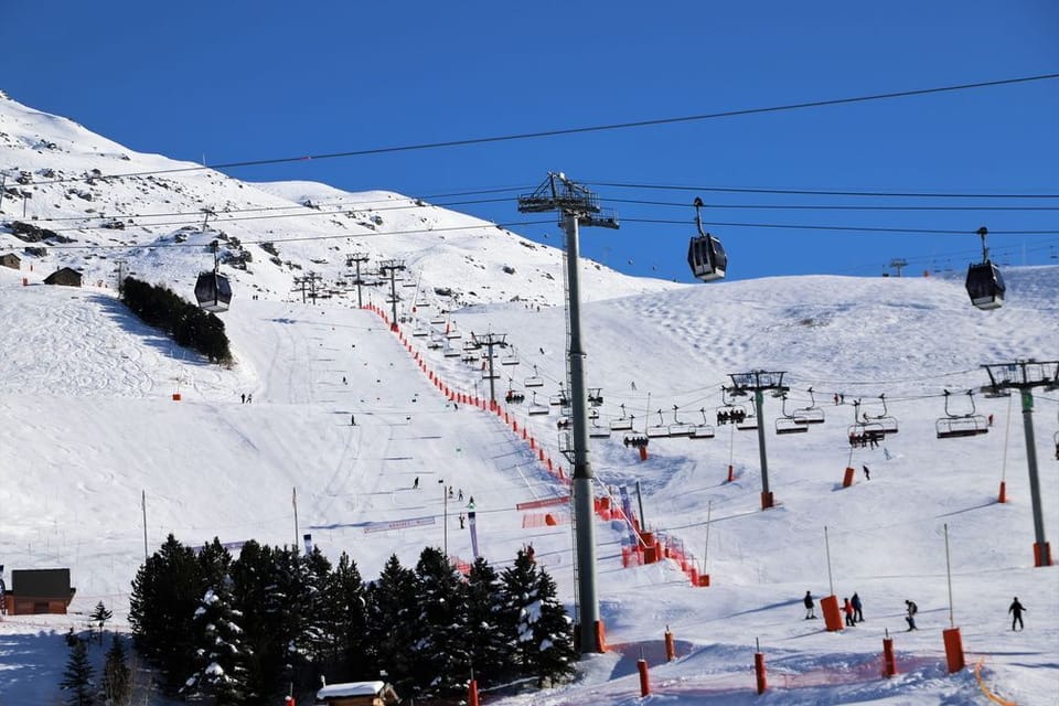 The expansive Trois Vallées ski area — 600km of pistes and 174 lifts connect Les Menuires to the wider domain.
