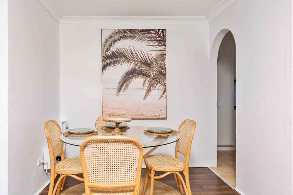 Sit down to a shared meal at home at the four-person dining table within the living area.
