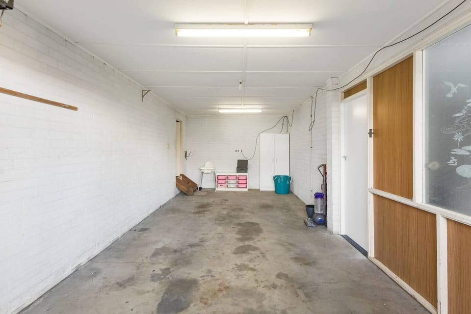 A lock-up garage allows parking in addition to the driveway spot.