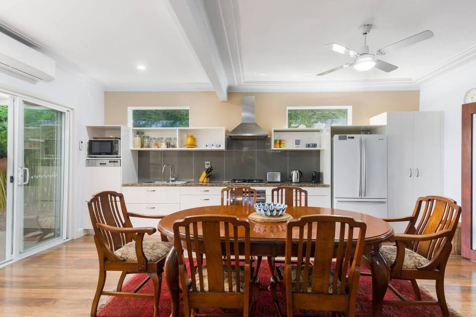 A spacious kitchen and dining area opens out to the backyard.