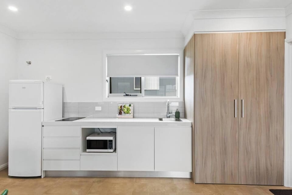 The kitchen comes well equipped to cook a light meal at home, with a fridge, stove and microwave.
