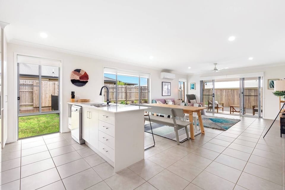 The open plan kitchen, living and dining room opens directly to the garden creating a seamless transition with t