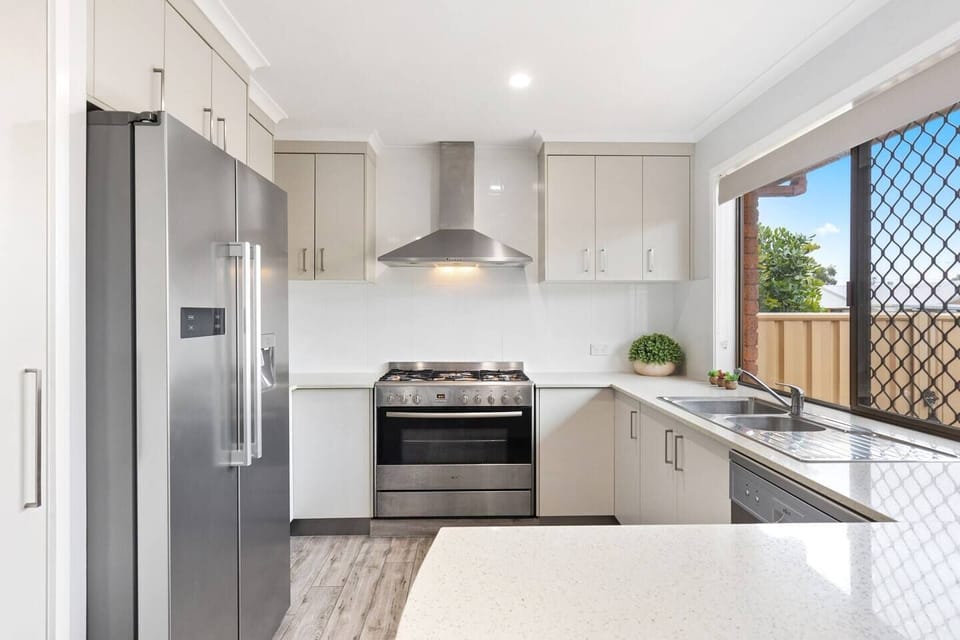The open-plan kitchen includes all you need to prepare meals at home.  
