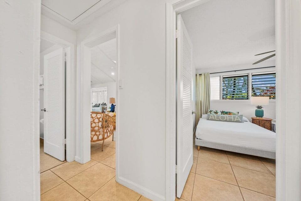 Step through this bright hallway into your serene bedroom