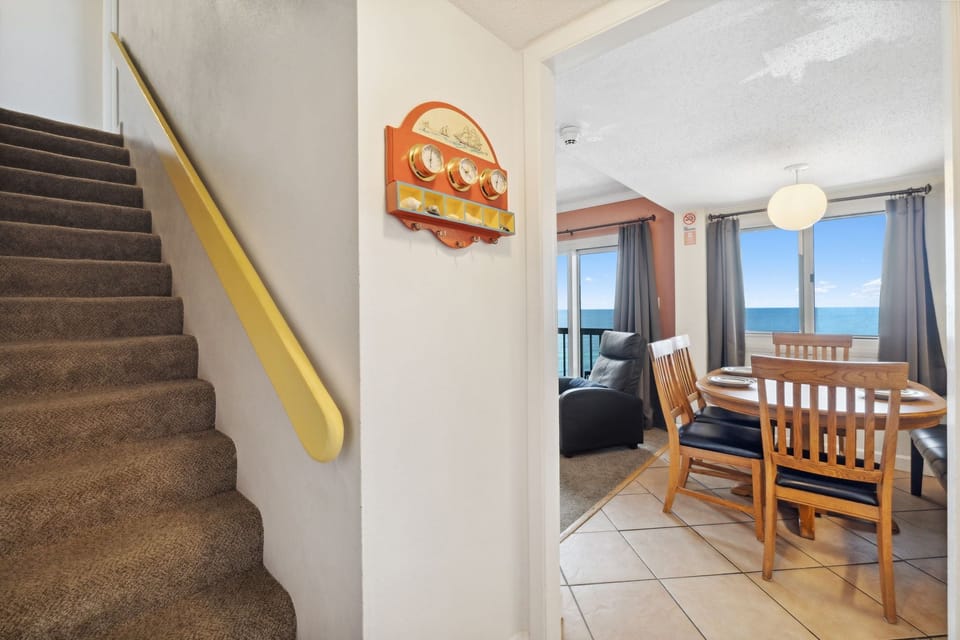 The stairs leading to the bedrooms upstairs.
