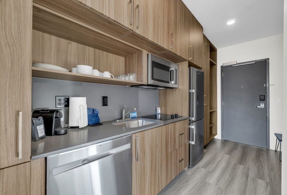 The fully stocked kitchen has stainless steel appliances, Nespresso, a toaster oven, and basic cookware so you can easily prepare delicious meals.