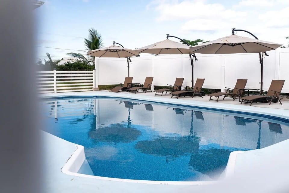 Pool area with seating and cover to enjoy the sunny Hawaiian days.