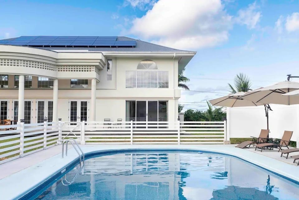 Pool area w/ seats and umbrellas to enjoy the sunny days with your family.
