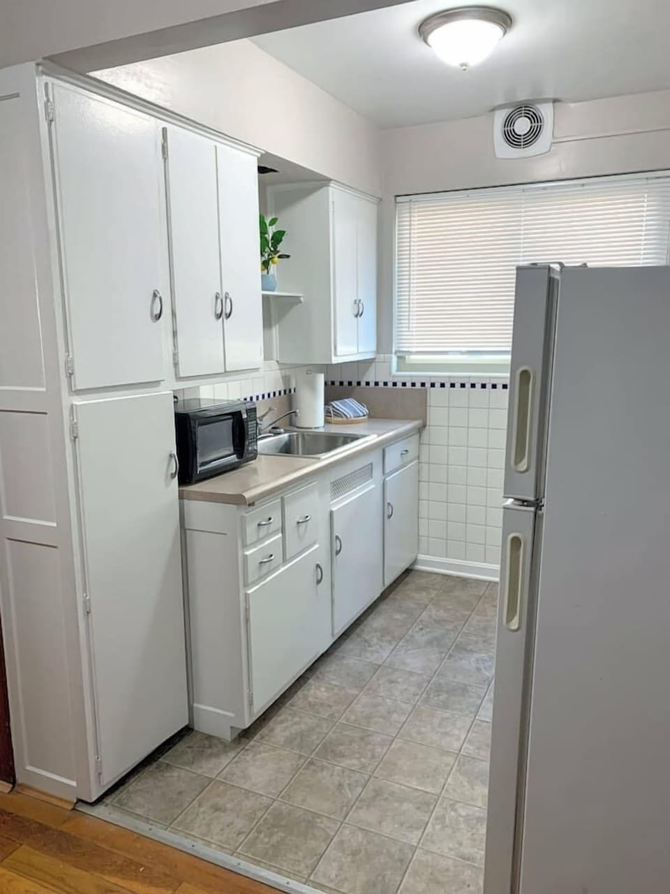 Fully stocked kitchen with microwave.