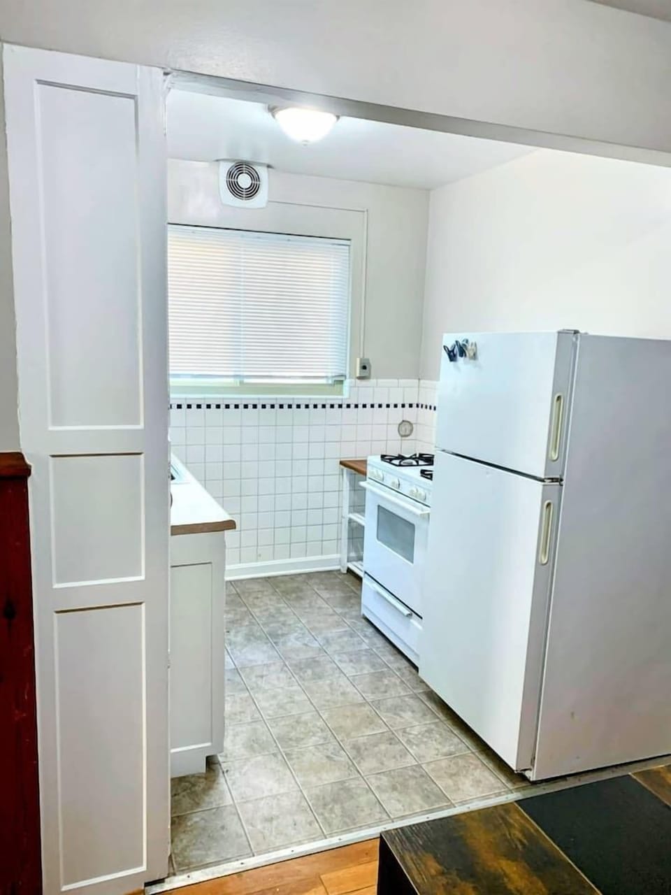 Full size refrigerator and gas range. 