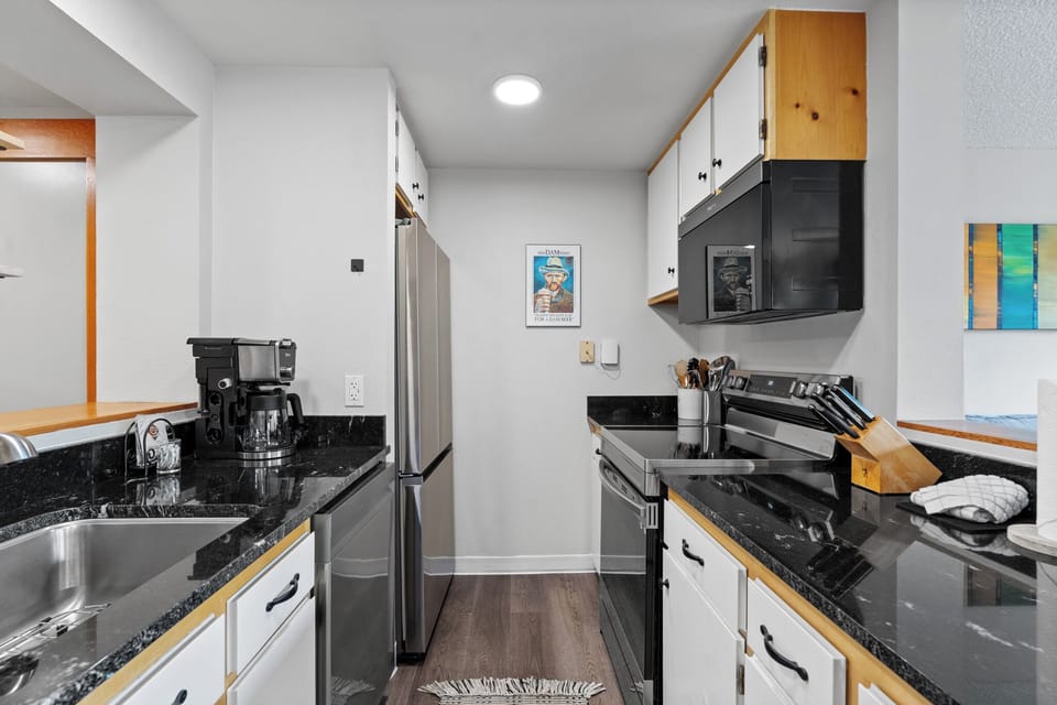 The newly updated full-sized kitchen is stocked with all the essential cookware and tableware to make a meal away from home.