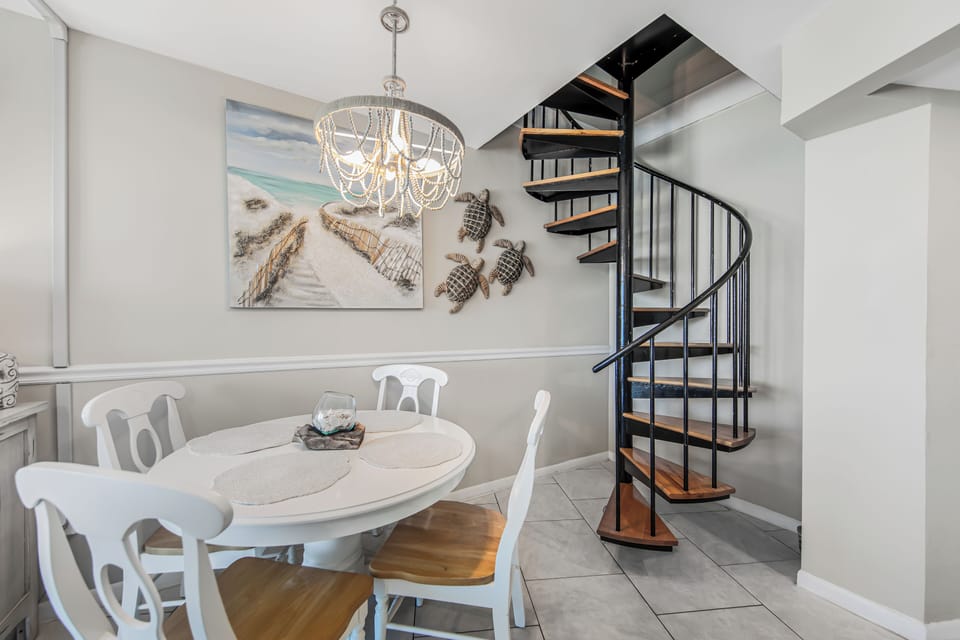 Dining Table and spiral staircase to 3rd Bedroom