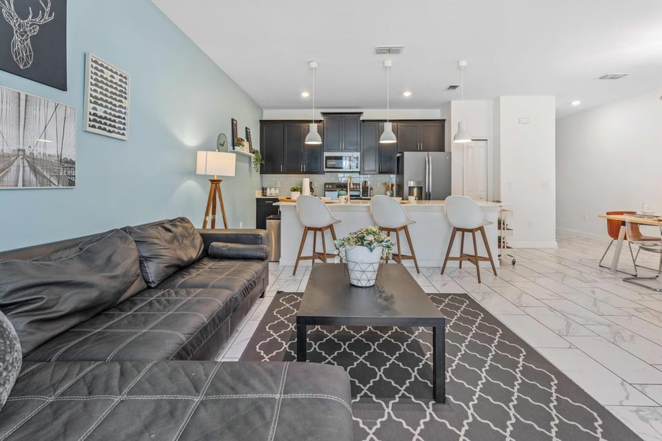 Marvelous living area of the apartment in Davenport - Cosy sofas - Elegantly decored living area - Large bright windows of the living area with Mesmerizing views - Beautifully furnished floor - Availability of TV and Netflix